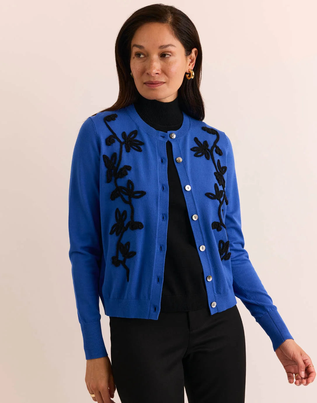Woman wearing a blue cardigan with black floral embroidery by The H Edition Kaylee Long Sleeve Embroidery Cardigan Electric Blue
