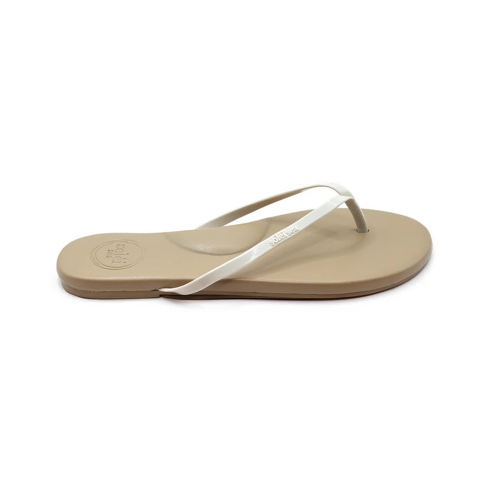 Beige sandal with white strap on a white background
