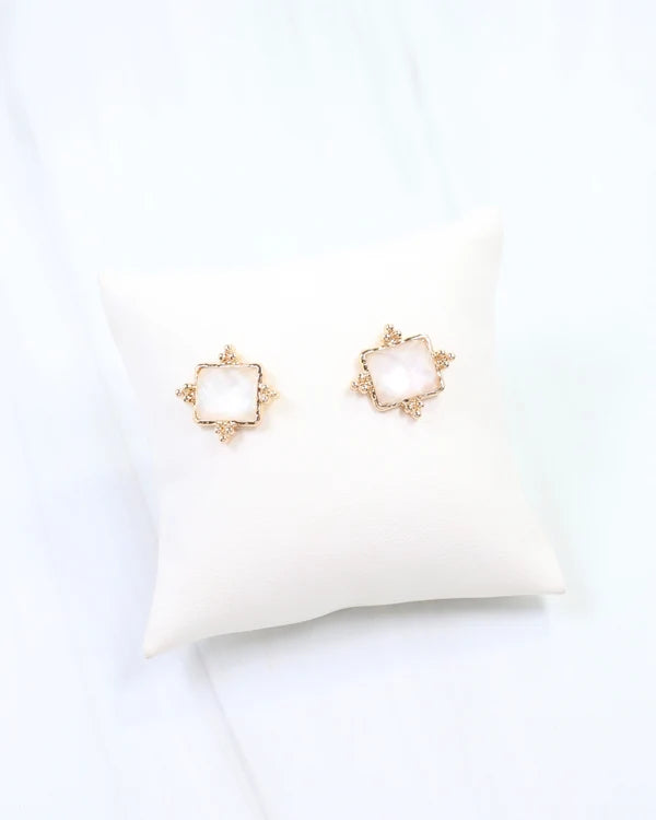 Caroline hill Kerang Square Facited Stud Earring White a pair of gold-tone stud earrings with square white mother-of-pearl centers.