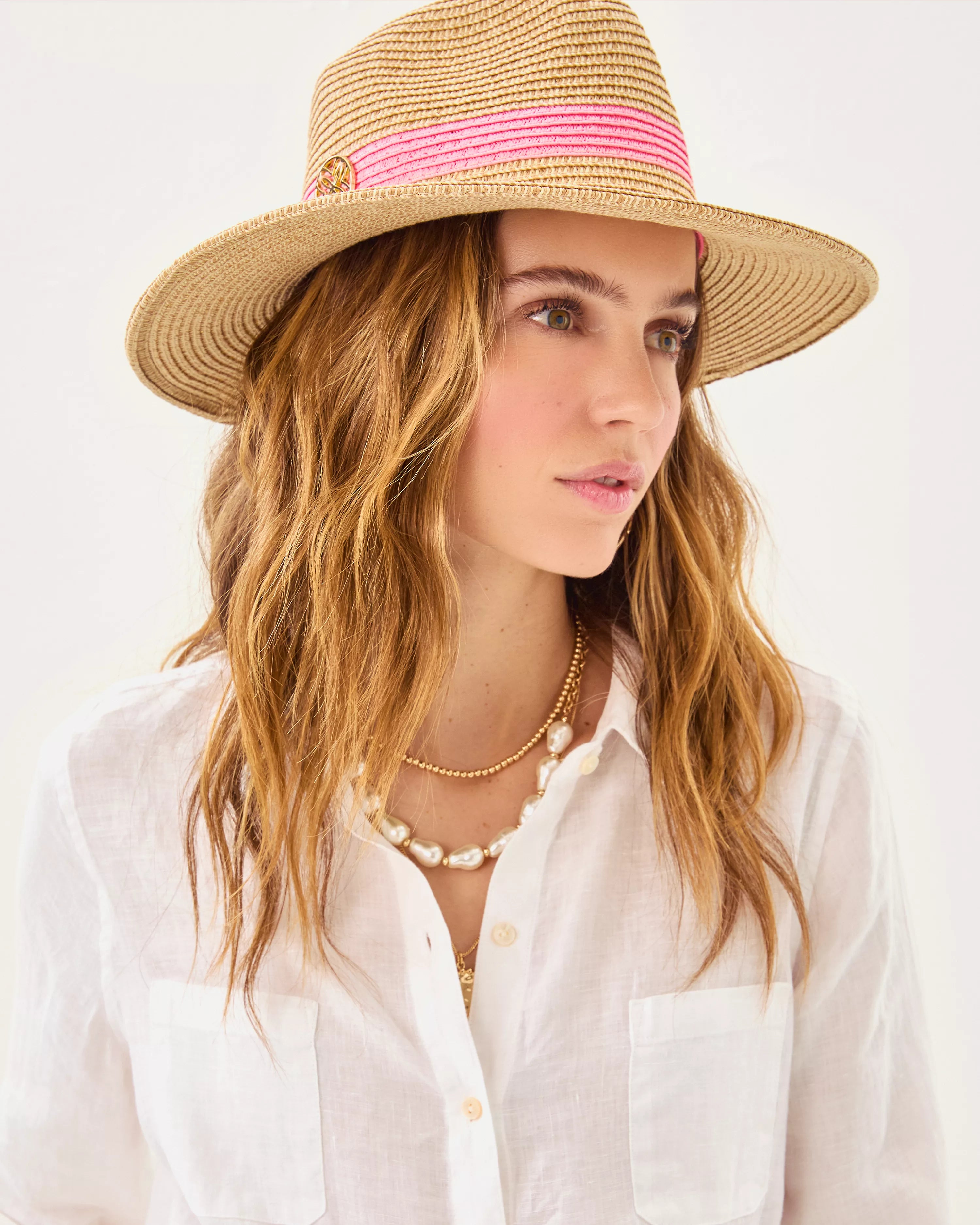Lilly Pulitzer Shade Seeker Hat in rousseau pink straw hat with a pink band