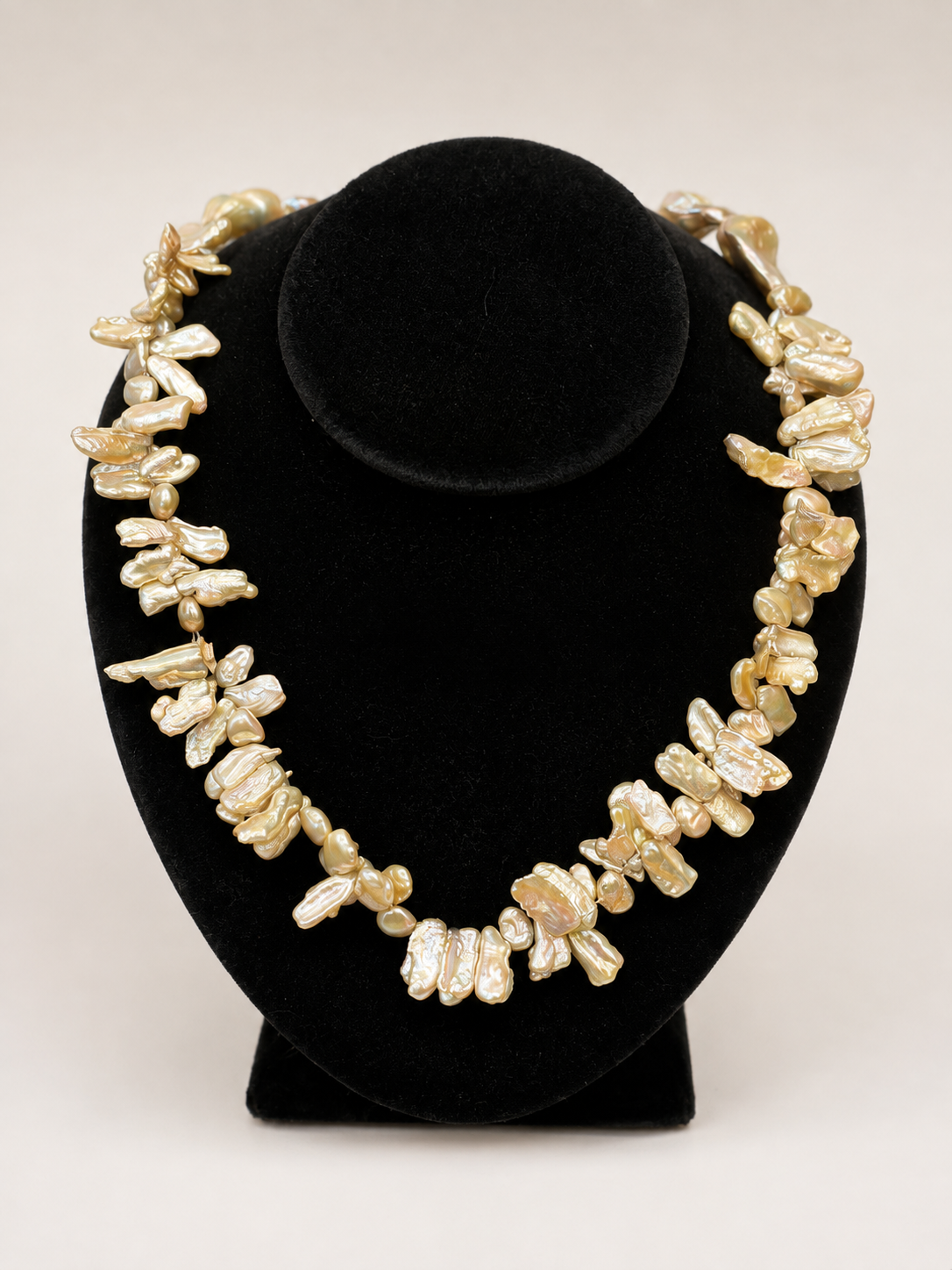 A chunky statement necklace made of irregular, organic-shaped cream pearls by MM Designs Large baroque and stick pearl necklace featuring a lustrous cream-toned freshwater pearl design