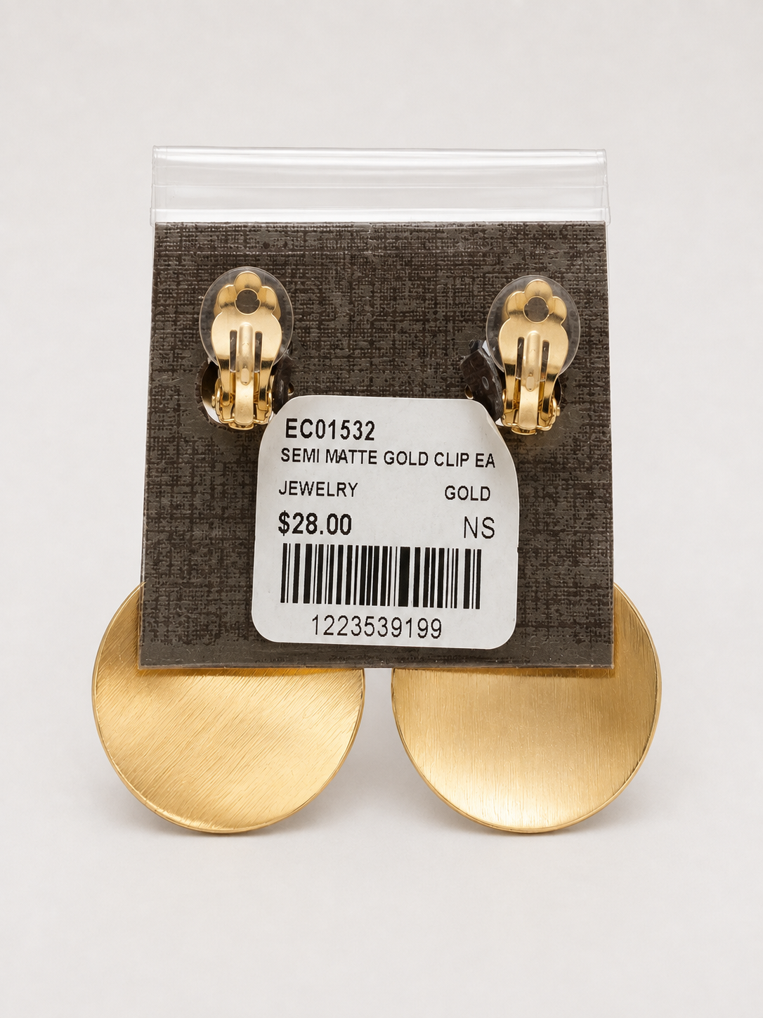 A pair of large, disc-shaped gold earrings Semi Matte Oval Gold Clip Earring