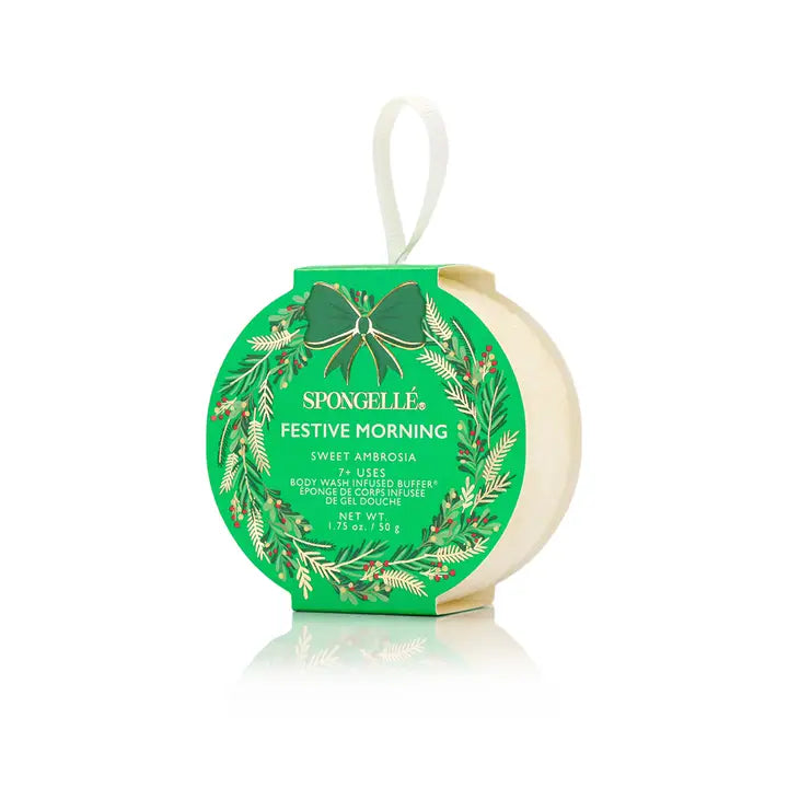 Spongellé festive body buffer product with green packaging in sweet ambrosia and white background