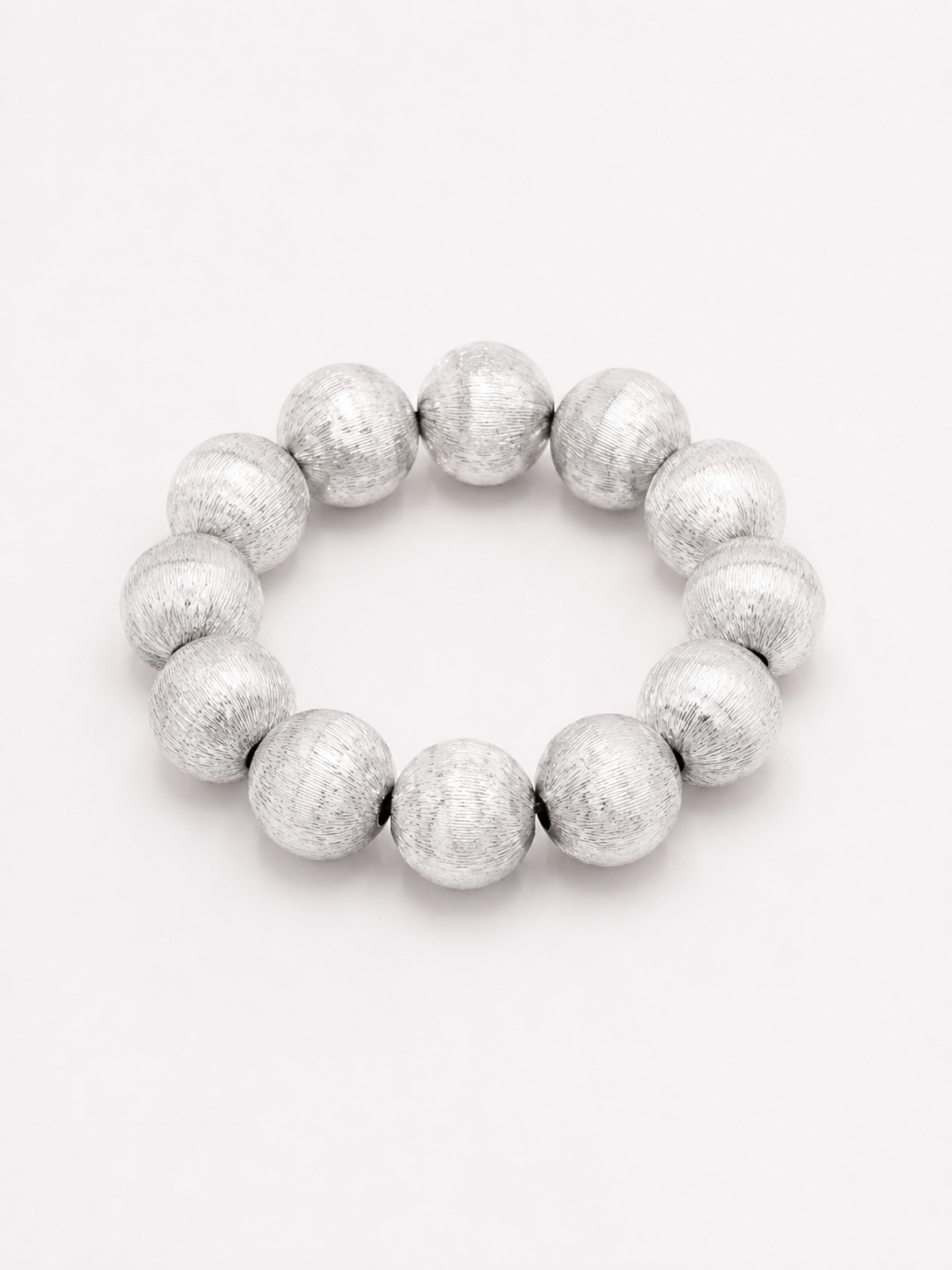 A beaded stretch bracelet made of glossy, round brushed silver beads. Uga, georgia football, university of Georgia game day jewelry.