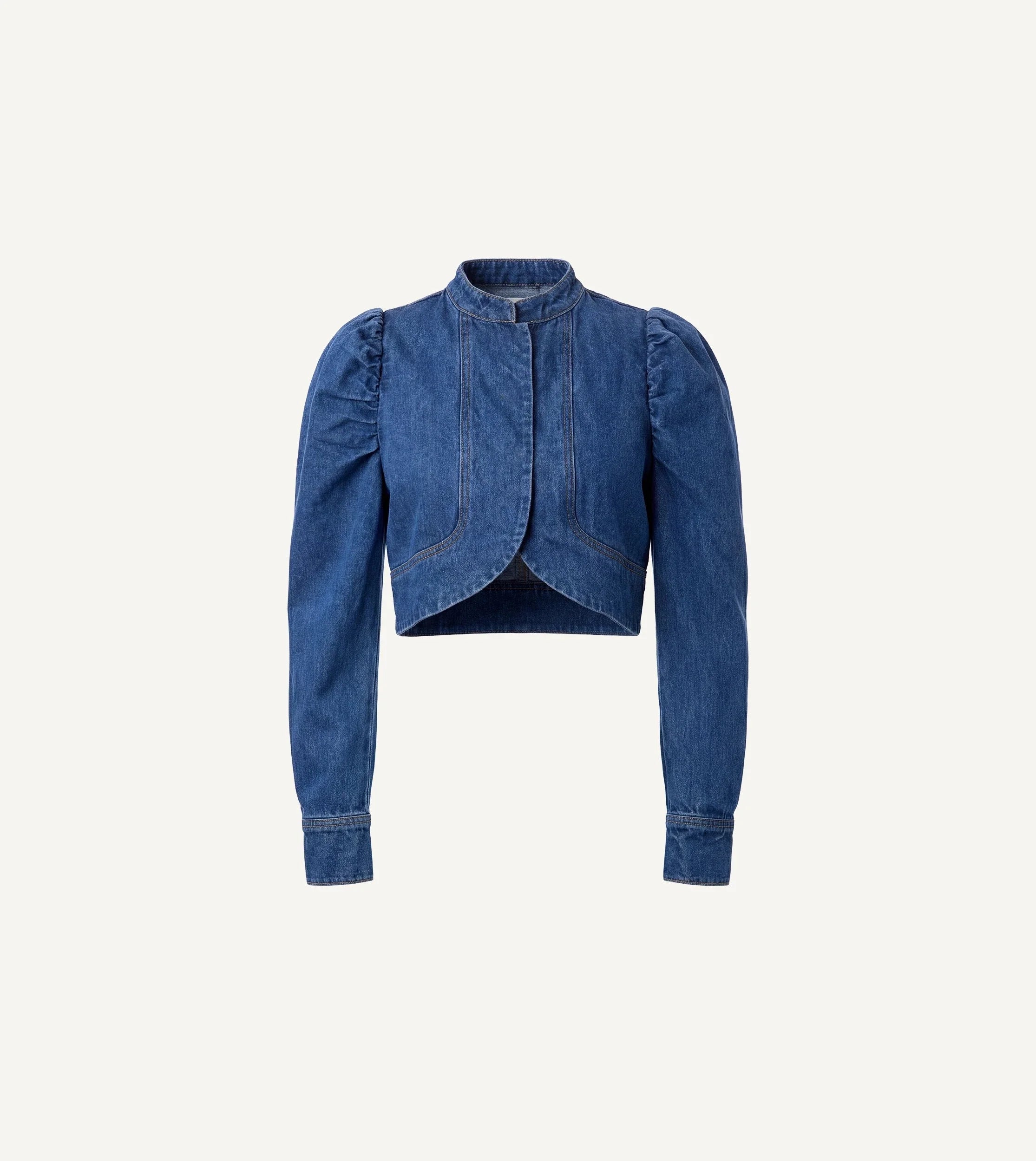 Woman Cleobella | Damien Denim Jacket blue denim jacket over a light green dress on a beige background