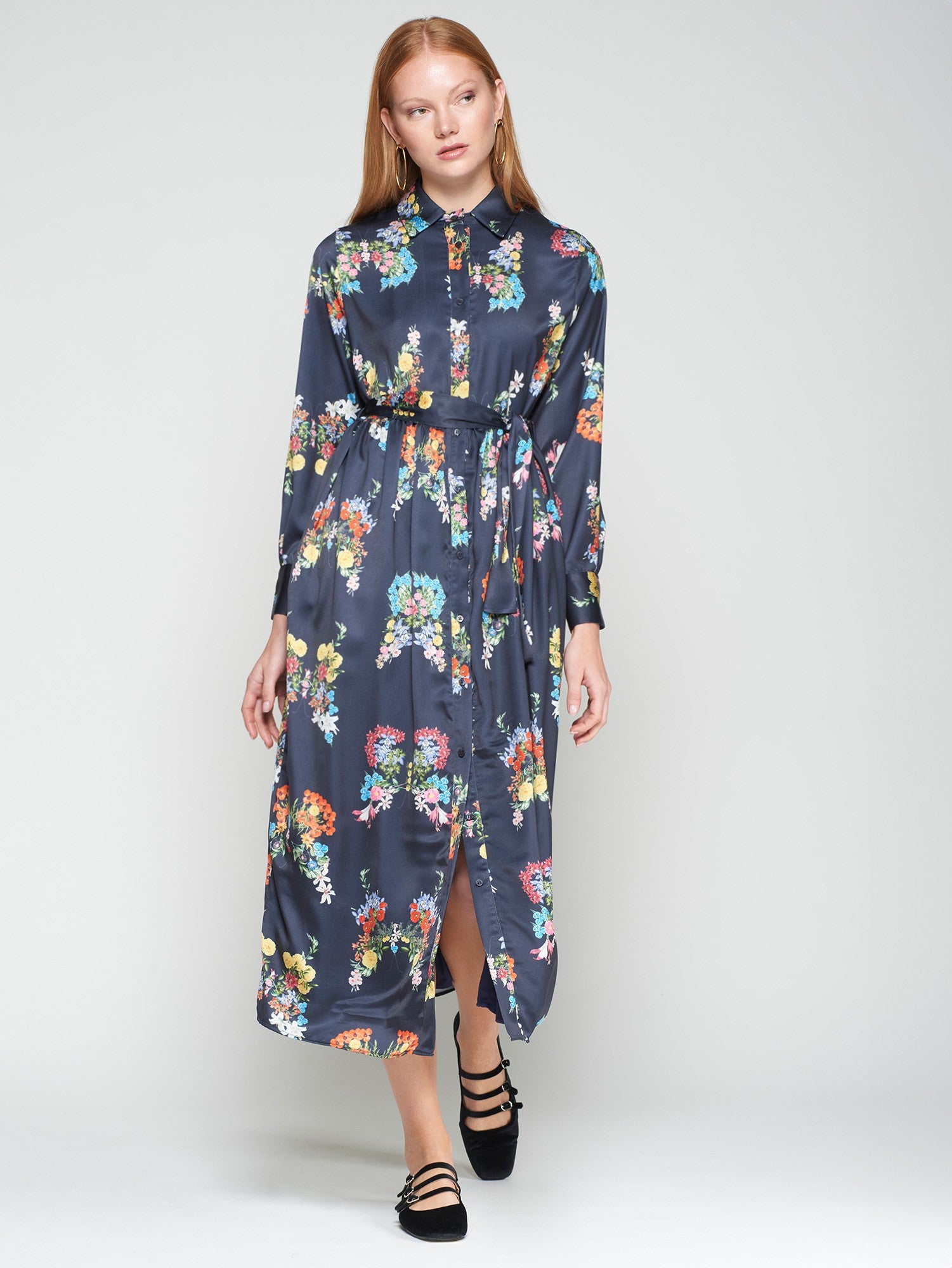 Woman wearing a floral dress on a white background