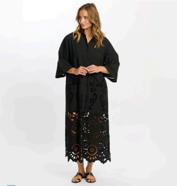 Woman wearing a black lace dress on a white background