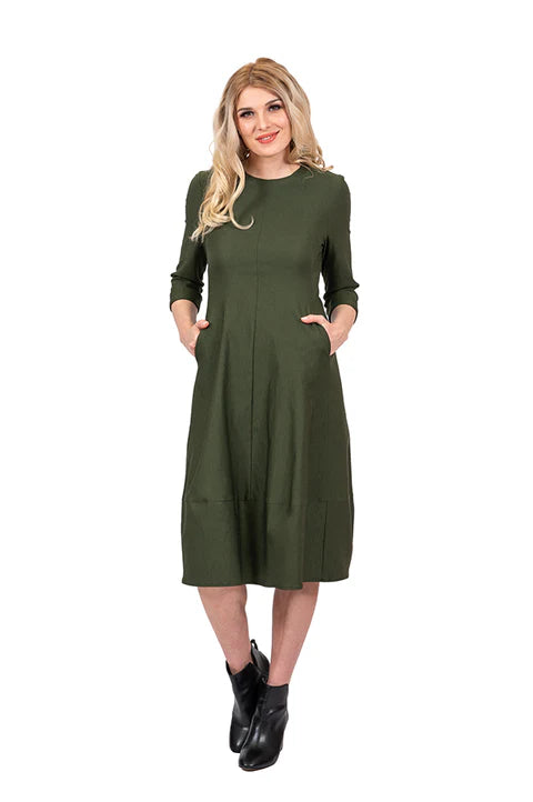 Woman wearing a green dress on a white background