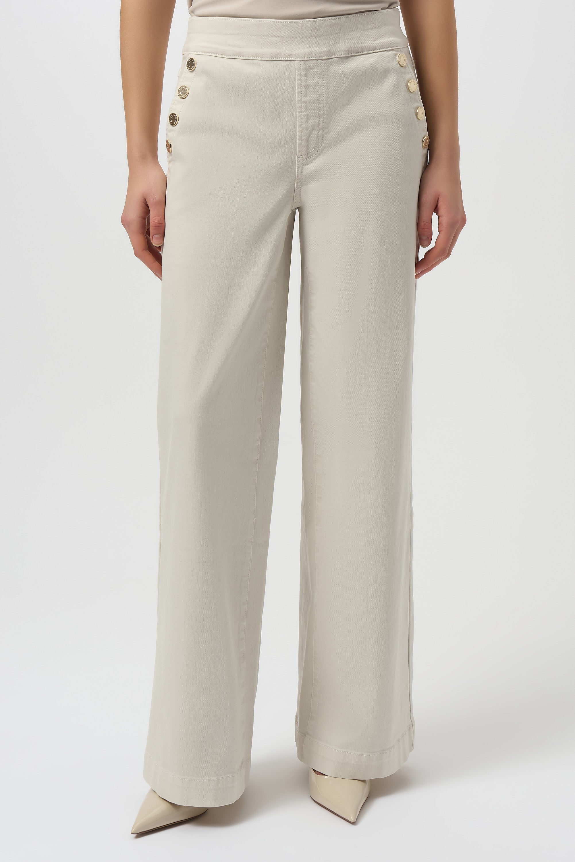 Beige wide-leg pants with button details on a white background