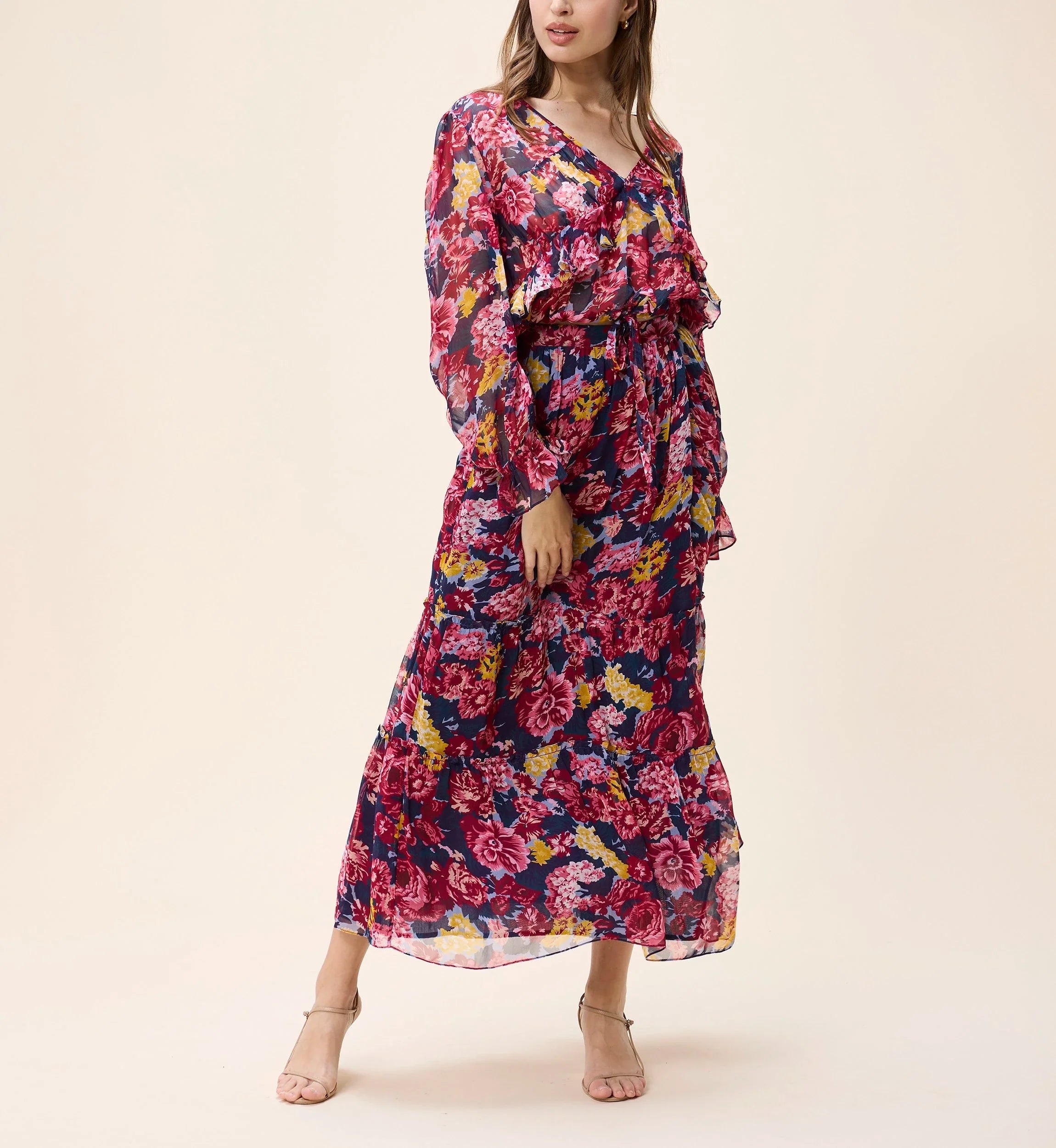 Woman wearing a floral dress on a beige background