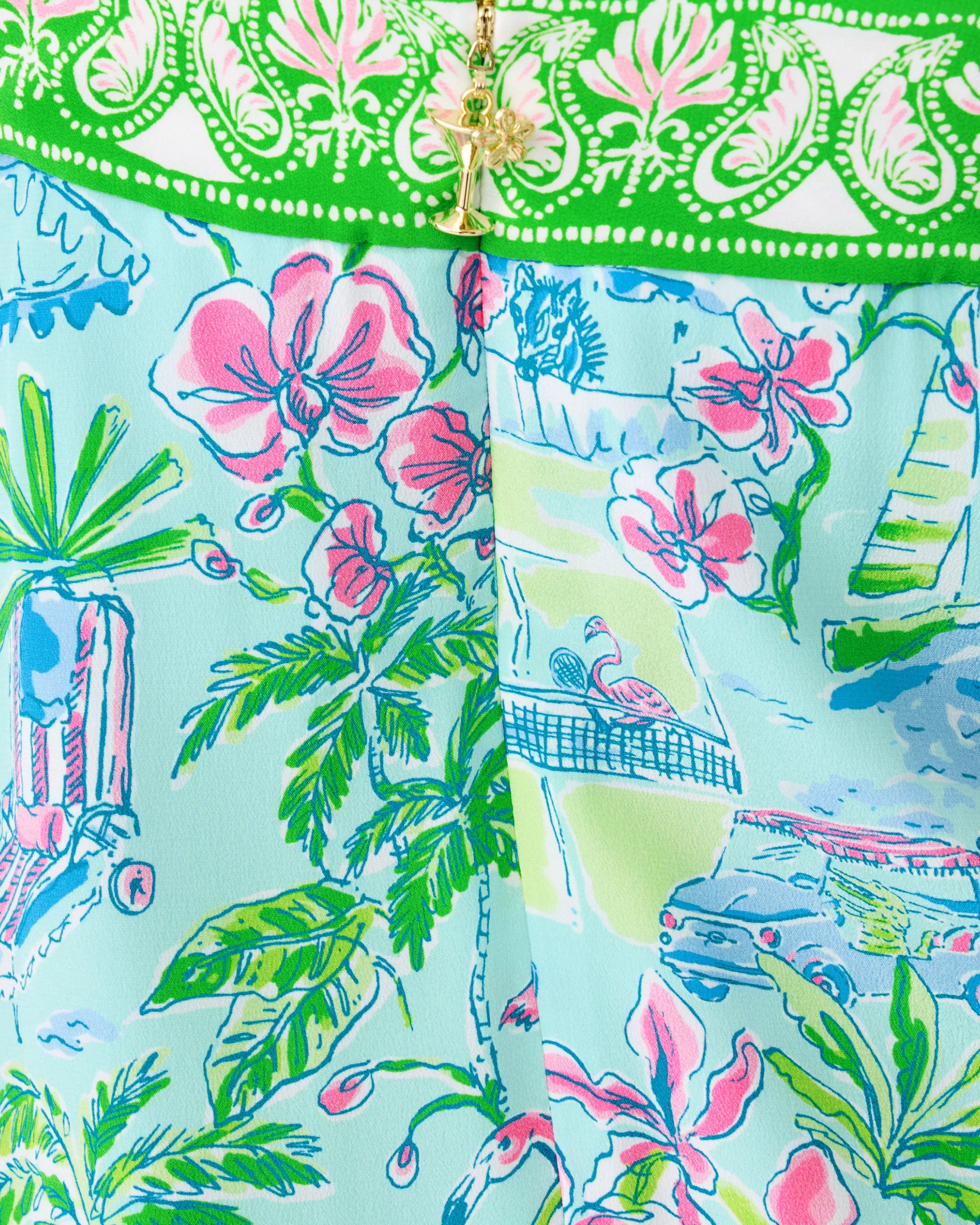 Colorful fabric with floral and nature patterns on a light blue background