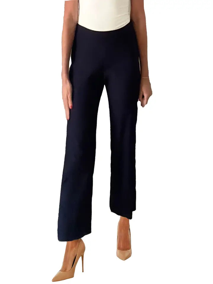 Navy blue pants worn by a person on a white background