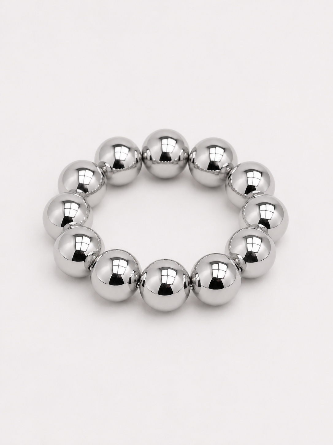 A beaded stretch bracelet made of glossy, round silver beads. Uga, georgia football, university of Georgia game day jewelry.