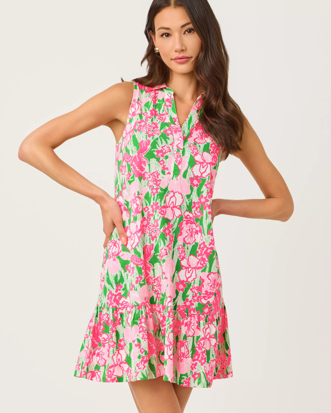 Woman wearing a pink floral dress on a white background