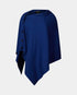 Blue poncho with button details on a light gray background