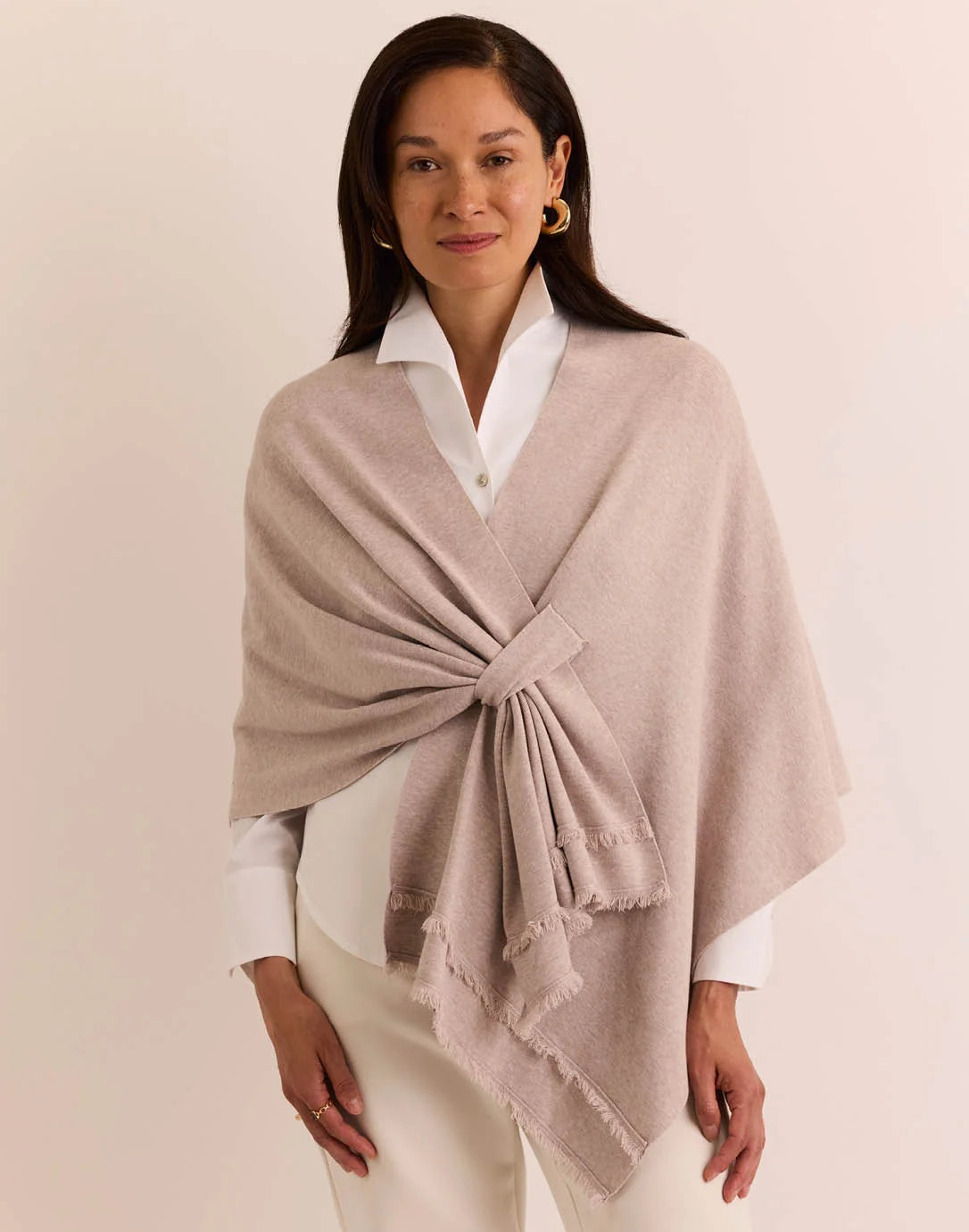 Woman wearing a beige shawl the h edition Mabel Tab Fringe Wrap stone heather