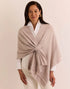 Woman wearing a beige shawl the h edition Mabel Tab Fringe Wrap stone heather