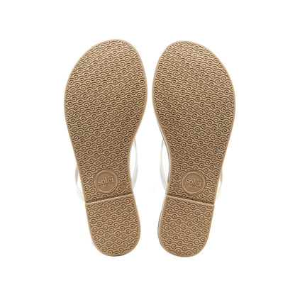 Tan flip-flop soles with a pattern on a white background