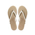 Pair of beige flip-flops with white straps on a white background