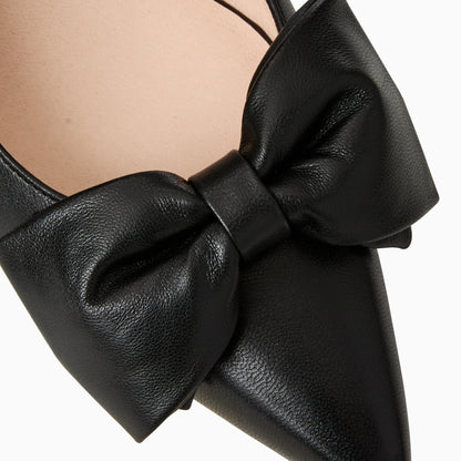Black leather bow detail on a white background
