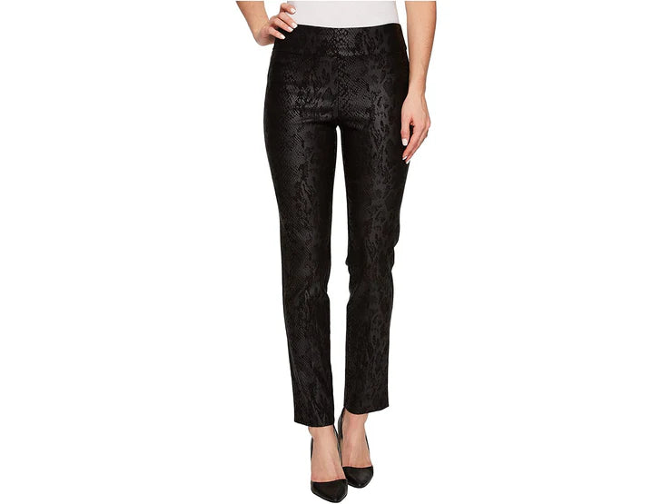 Black snake patterned pants worn by a person on a white background