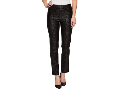 Black snake patterned pants worn by a person on a white background