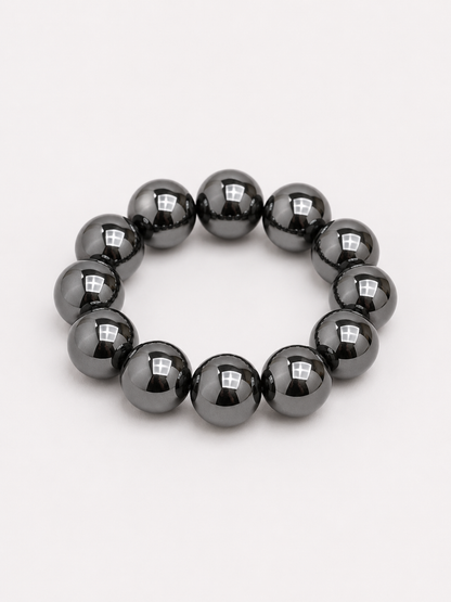 A beaded stretch bracelet made of glossy, round black beads. Uga, georgia football, university of Georgia game day jewelry. 