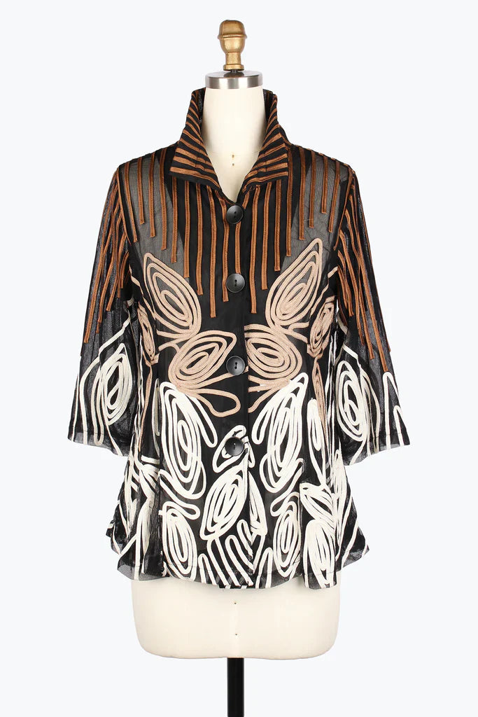 Patterned blouse on a mannequin against a white background