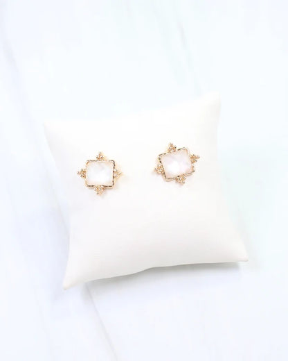 Caroline hill Kerang Square Facited Stud Earring White a pair of gold-tone stud earrings with square white mother-of-pearl centers.