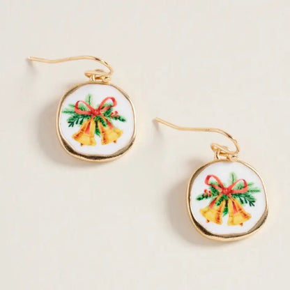 Earrings with Christmas-themed design on a beige background