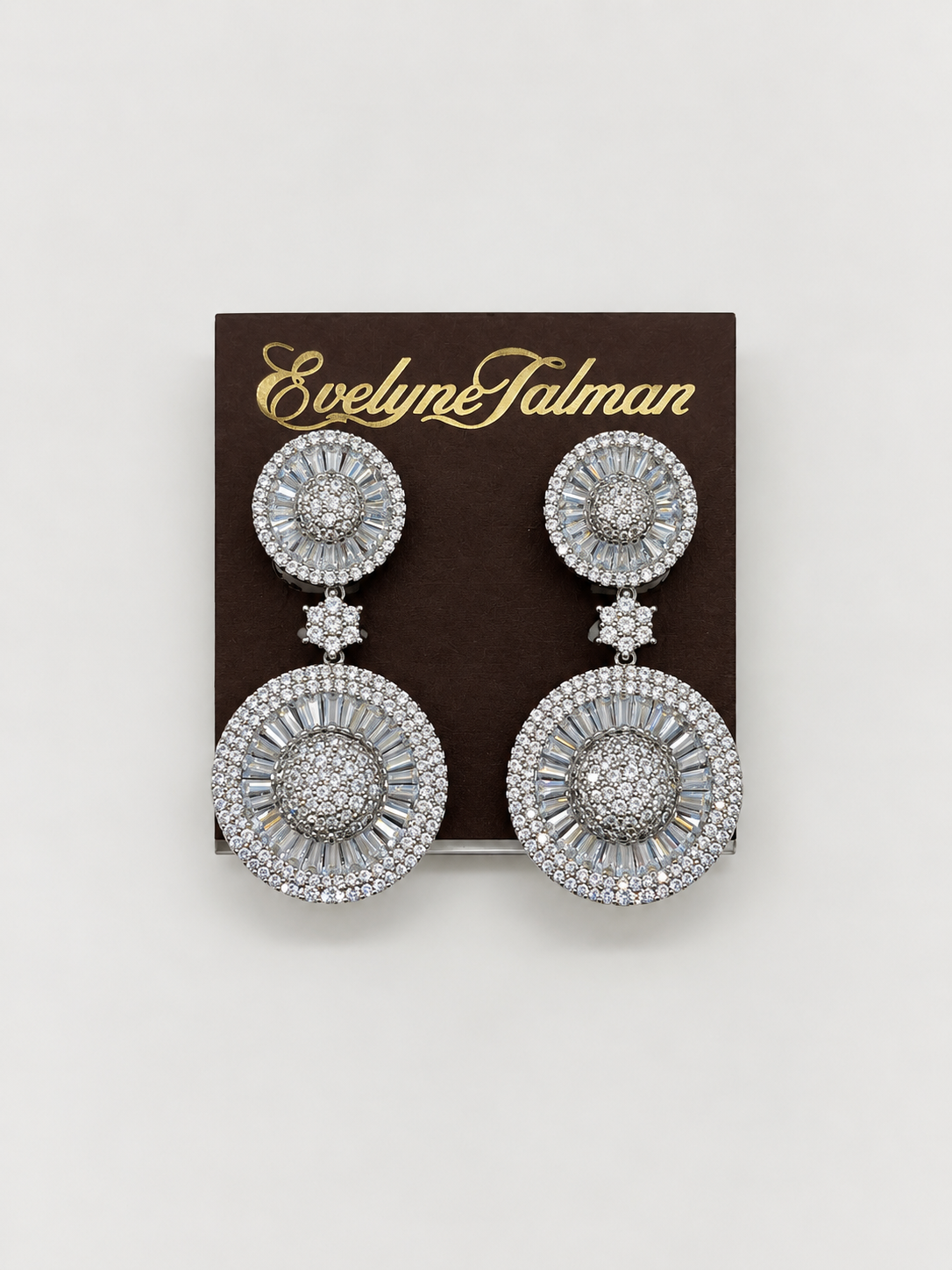 A pair of large silver-tone drop earrings with multiple circular clusters of clear stones, Double Circle CZ Clip-on Earrings