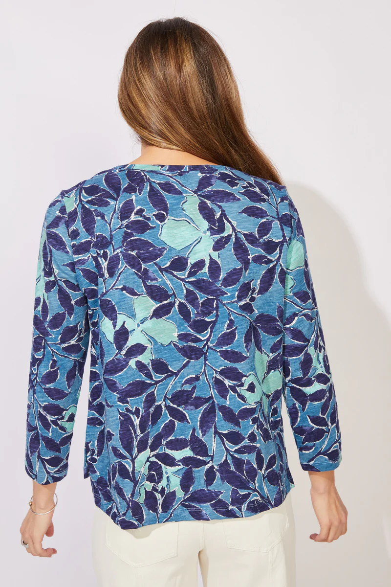 Woman wearing a blue floral patterned top ESCAPE BY HABITAT  FOLIAGE FLORAL COTTON BOXY TEE - 12125 Color Harbor