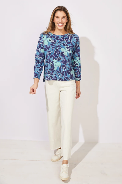 Woman wearing a blue floral patterned top ESCAPE BY HABITAT  FOLIAGE FLORAL COTTON BOXY TEE - 12125 Color Harbor