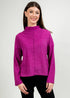 Woman wearing a fuchsia sweater against a plain background