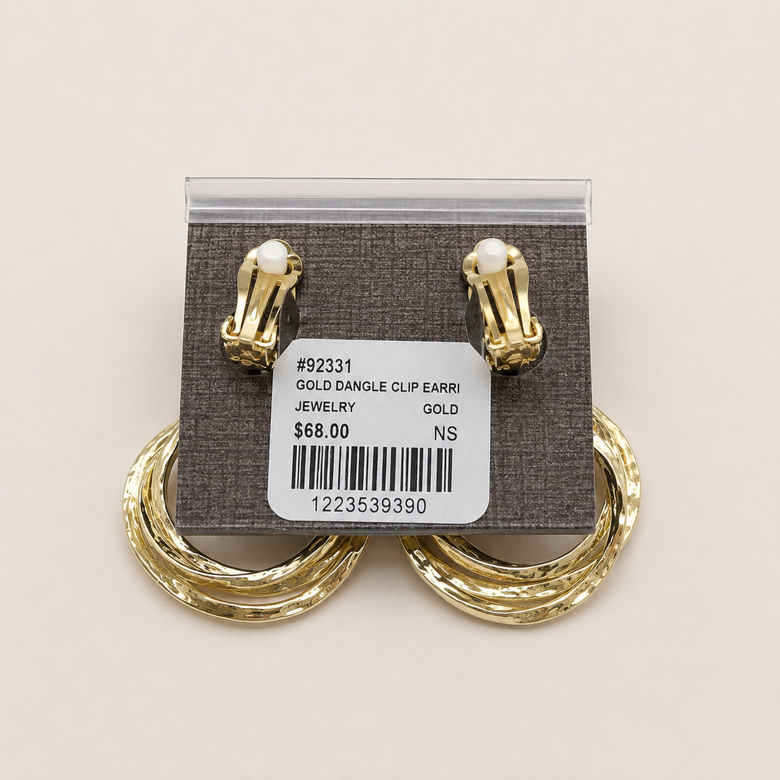 A pair of gold-tone double hoop drop earrings with textured square studs.