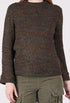 Woman wearing a brown patterned sweater
