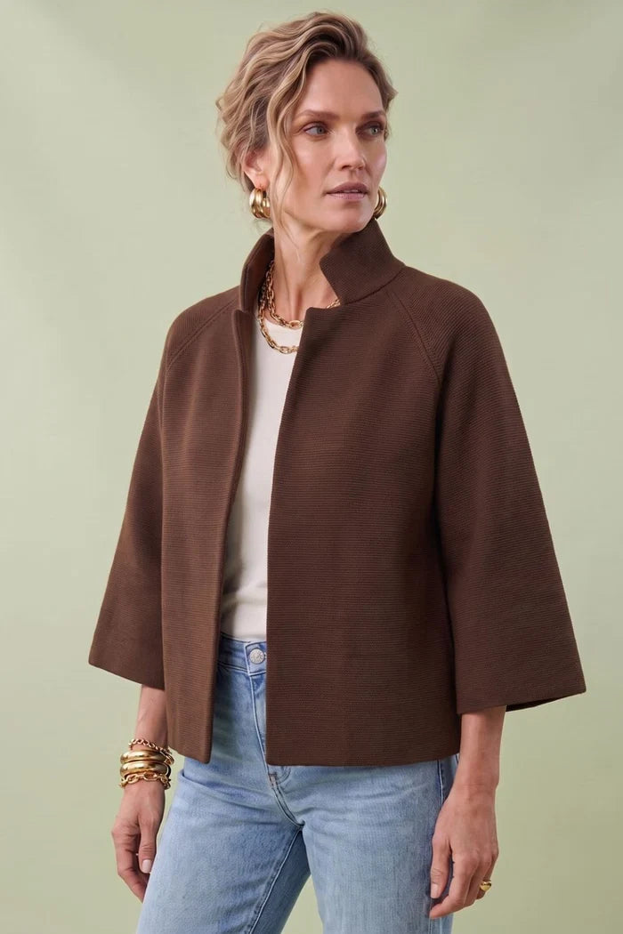 A woman modeling a brown cropped cape jacket with wide three-quarter sleeves by Jenvie The Bristol Jacket in French Toast Chocolate Brown