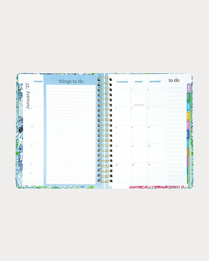 Lilly Pulitzer 2026-2027 17 Month Jumbo Agenda Spiral-bound planner with a decorative cover featuring sea shells and fish in the Color Day Dream Blue Throw Me A Line