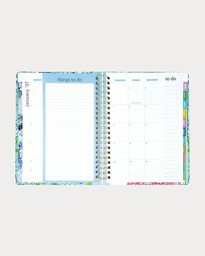 Lilly Pulitzer 2026-2027 17 Month Jumbo Agenda Spiral-bound planner with a decorative cover featuring sea shells and fish in the Color Day Dream Blue Throw Me A Line