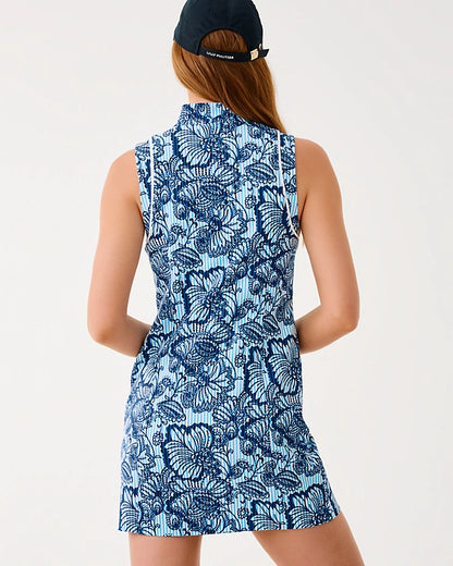 Person wearing a blue butterfly patterned dress on a white background