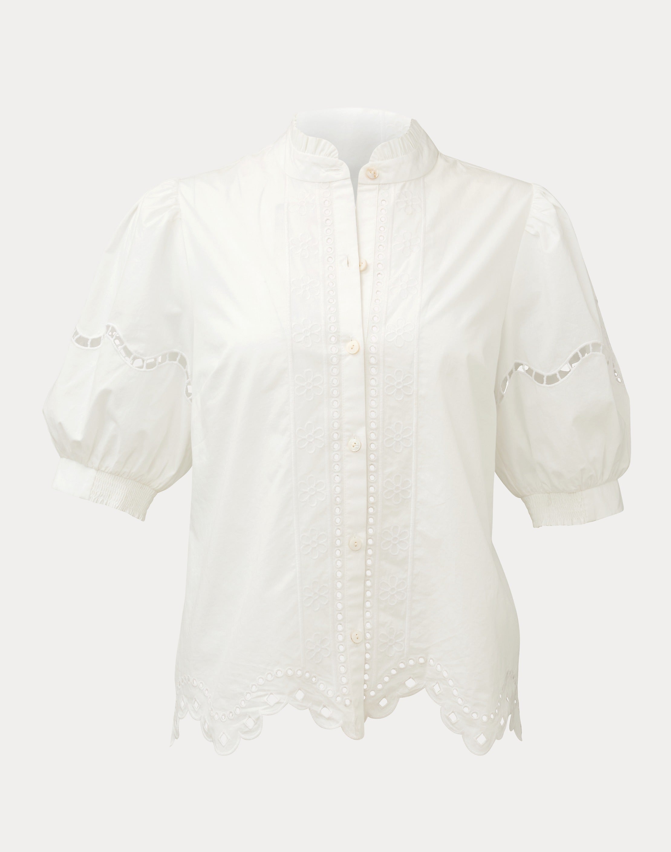 White blouse with lace details on a white background