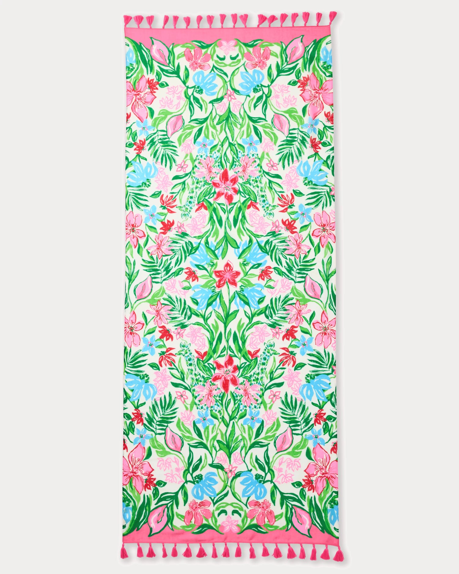 Floral patterned towel with pink border and tassels on a white background