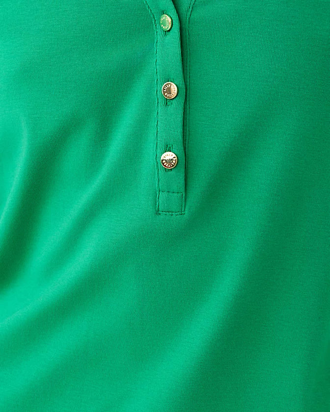 Close-up of a green polo shirt with buttons