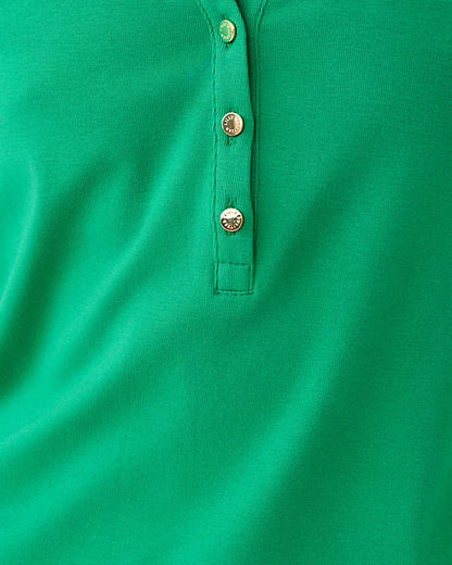 Close-up of a green polo shirt with buttons