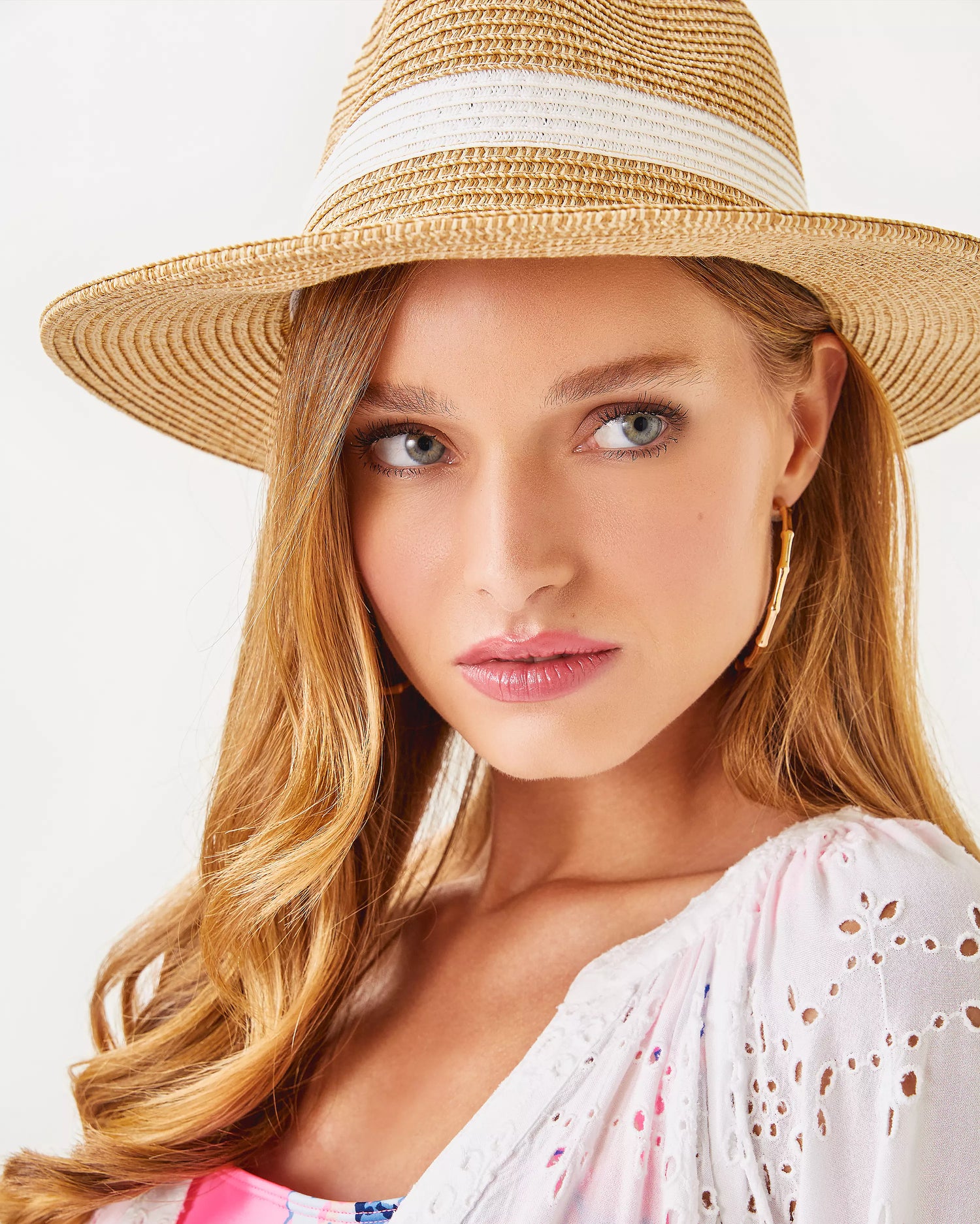 Lilly Pulitzer Shade Seeker Hat in resort white beige straw hat with a white band and gold emblem 