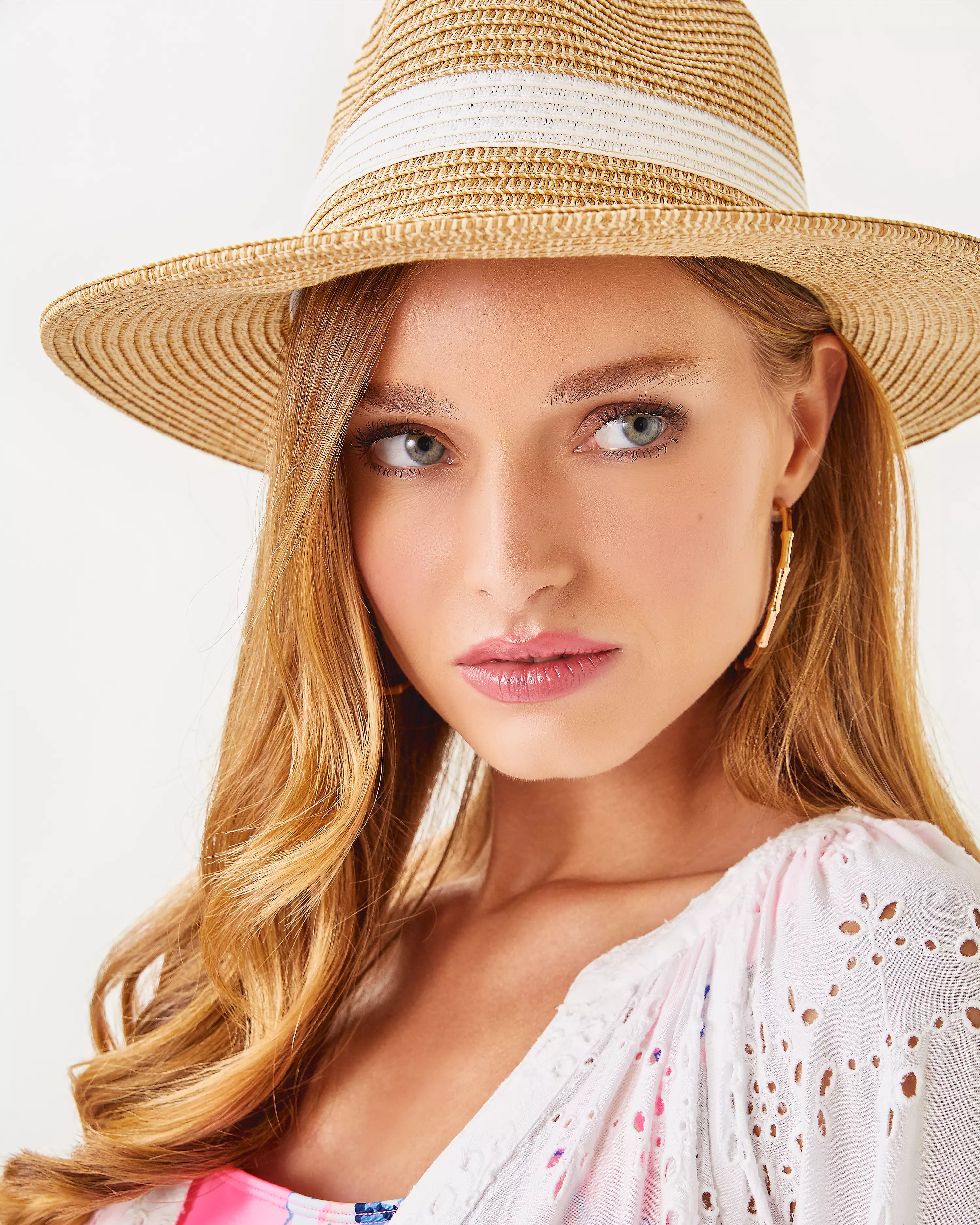 Lilly Pulitzer Shade Seeker Hat in resort white beige straw hat with a white band and gold emblem 