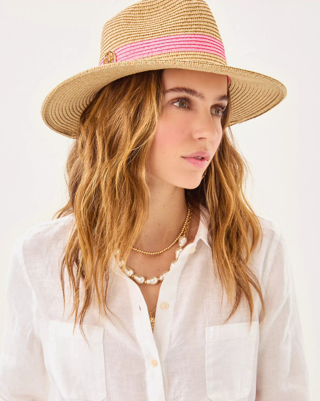 Lilly Pulitzer Shade Seeker Hat in rousseau pink straw hat with a pink band 