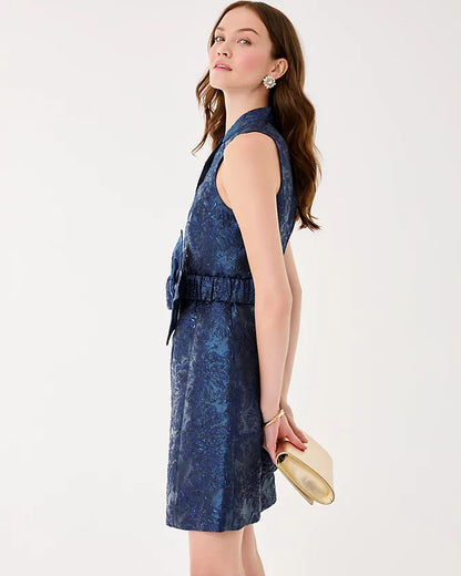 Woman wearing a blue dress with a white background