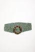 A wide waist belt made of tightly woven turquoise beads, featuring a large oval buckle with a brown and gold striped pattern by Mare Sole Amore Gold Galaxy Slip On Stretch Belt