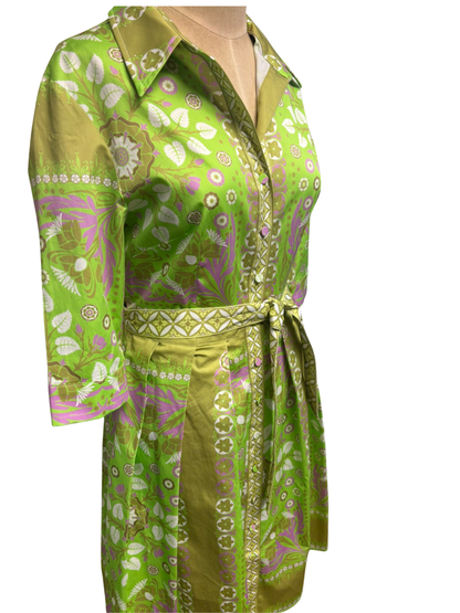 Green patterned shirt and pants set on a white background
